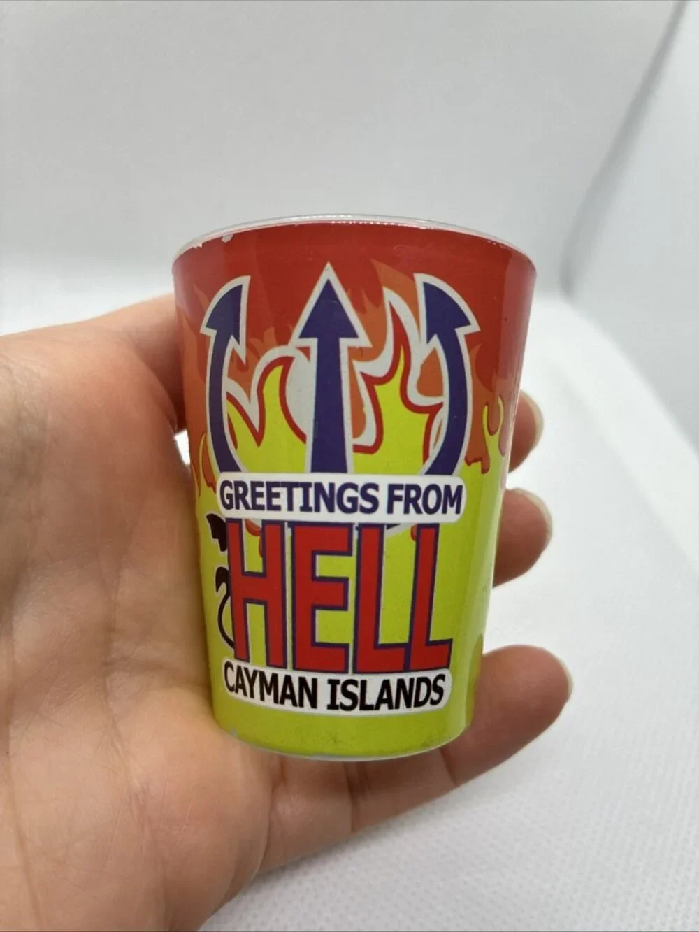 Vintage Greetings From Hell Cayman Islands Shot Glass Souvenir Red Green Flames